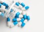 Antibiotic,Pills,And,Bottle,On,White,Background,,Top,View.,Space