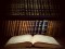 Open,Old,Book,On,A,Bookshelf,Background.,Selective,Focus.